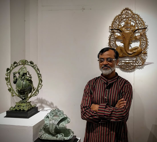 Somnath Chakraborty with his Bronze Ganesha sculptures for the exhibition at Indiaart Gallery, Pune