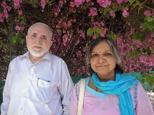 Mrs. and Mr. Maruti Patil at Indiaart Gallery, Pune with the beautiful bougainvillea in the background