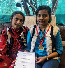 Dighi Banerjee with her medal and certificate at Indiaart Gallery, Pune with her mother Kabari Banerjee