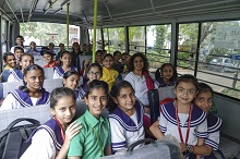 Children from Mansukhbhai Kothari National School in their bus 