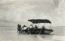 A jet boat from Sir  Edmund Hillary's India - New Zealand expedition on the Ganges that hit a sandbar in the middle of the mighty river, Photo by Prem Vaidya