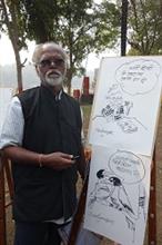 Vaijnath Dulange with his finished cartoon drawings