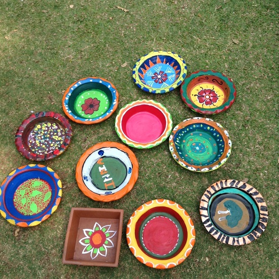 Art Event Children paint earthen pots at Pune as their Holi celebrations