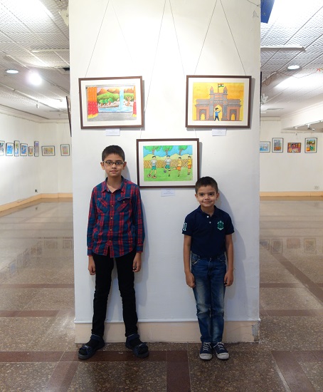 Suveer Upasani with his brother in front
of his painting at Khula Aasmaan -
Children's Art Exhibition - Edition I
presented by Indiaart