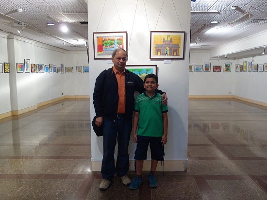 Milind Sathe with Tanmay Karve, one of the
participating child artists at Khula Aasmaan -
Children's Art Exhibition - Edition I