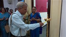 Mr Deepak Ghare lighting the lamp at the inauguration of the show Beautiful Spaces at Jehangir Art Gallery, Mumbai