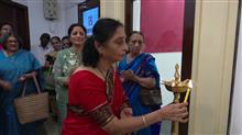 Mrs Jayashree Vaidya lighting the lamp at the inauguration of the show Beautiful Spaces at Jehangir Art Gallery
