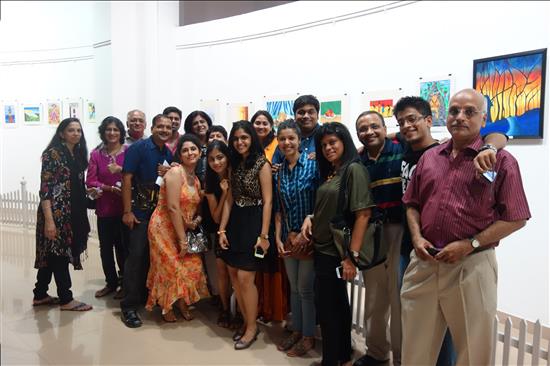 Family get-together to appreciate the artwork of the young artist in the family