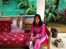 Sudha Srivastava with her paintings at the second edition of Emerging Artists Show at Indiaart Gallery, Pune