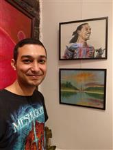 Varjavan Dastoor with his paintings at the second edition of Emerging Artists Show at Indiaart Gallery, Pune