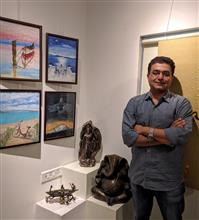 Vikram Jadhav with his parents at the second edition of Emerging Artists Show at Indiaart Gallery, Pune