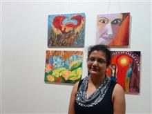 Namrata Biswas with her paintings at the Emerging Artists show presented by Indiaart.com