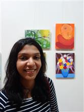 Sohini Ghosh with her paintings at the Emerging Artists show presented by Indiaart.com 