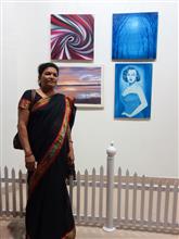 Urmila Nagle with her paintings at the Emerging Artists show presented by Indiaart.com at Nehru Centre, Mumbai 