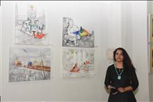 Amita Goswami with her paintings at the Emerging Artists show presented by Indiaart.com at Nehru Centre, Mumbai