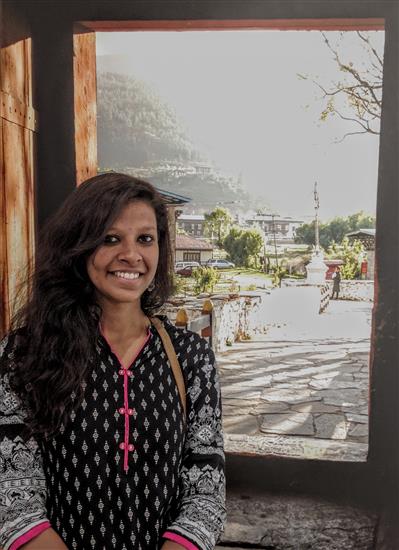 Anukriti Sharma in front of the picture - Looking out from Paro dzong at Indiaart Gallery