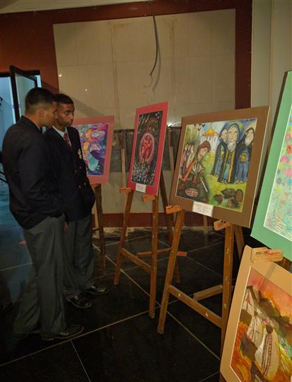 Cadets of National Defence Academy looking at paintings by Russian children - 1