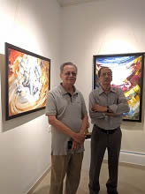 Friends of Artist Satish Pimple with his paintings at Indiaart Gallery, Pune