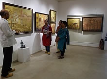 Shri Yashwant Shirwadkar talking to guests at Indiaart Gallery