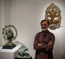 Somnath Chakraborty with his bronze Ganesha sculptures. 