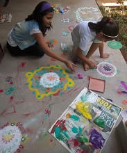 Participant enjoying the Rangoli workshop  at Indiaart Gallery - 2