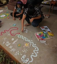 Participant enjoying the Rangoli workshop  at Indiaart Gallery - 3 