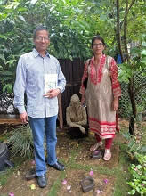 Shreeniwas and Meenal Shirsat with an outdoor sculpture at Indiaart Gallery