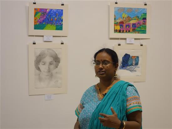 Nivedita Datta with painting of her student Anushka Kamble