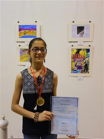 Rucha Damle with her medal and painting in the background at Khula Aasmaan exhibition at Mumbai - October 2017 