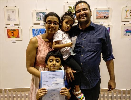 Utkkarsh Mehta with family and certificate 