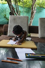 Young Shrutika paints at Indiaart Gallery 