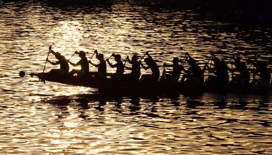 Sun Down - Snake boat race at Alleppey, Kerala, photograph by Kumar Mangwani
