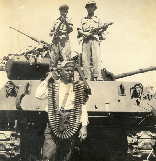 Photograph by Prem Vaidya - Prem Vaidya garlanded with a chain of machine-gun bullets