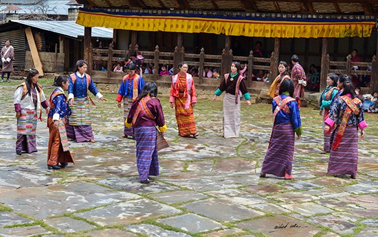Village women dancing at Ura festival, Bhutan, photograph by Milind Sathe