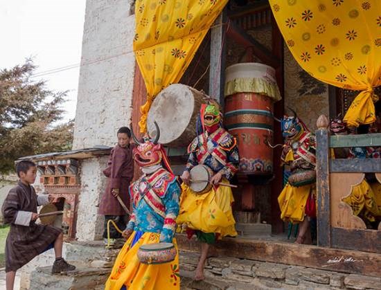 Artistes step out in the monastery courtyard for a dance ritual, photograph by Milind Sathe