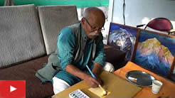Artist Kishor Randiwe paints Ganesha on a postcard