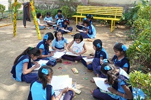 Girl students paint during art workshop at Warvada ashramshala