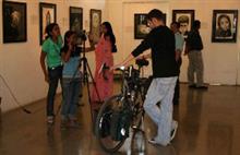 College students making a short news clip on exhbition