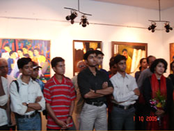 Viewers at Exhibition of Figurative Paintings