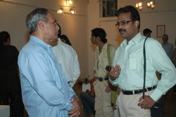 Visitors viewing sculptures made during ceramic camp
