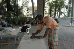 Sculptors working on creating sculptures in ceramics