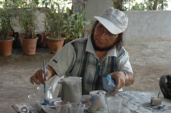 Sculptors working on creating sculptures in ceramics