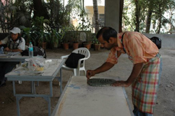 Sculptors working on creating sculptures in ceramics