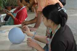 Sculptors working on creating sculptures in ceramics