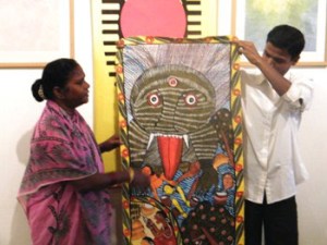 Karuna Chitrakar explaining about her painting on Tsunami