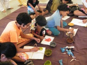 Children enjoying paintings using Vegitable Dyes colours