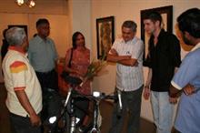 Visitors admiring Jake's Bicycle