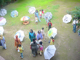 Visitors looking at umbrellas specially painted by Achyut Palav