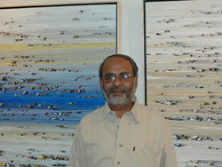 Artist Shamendu Sonawane with his paintings