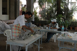 Sculptors working on creating sculptures in ceramics